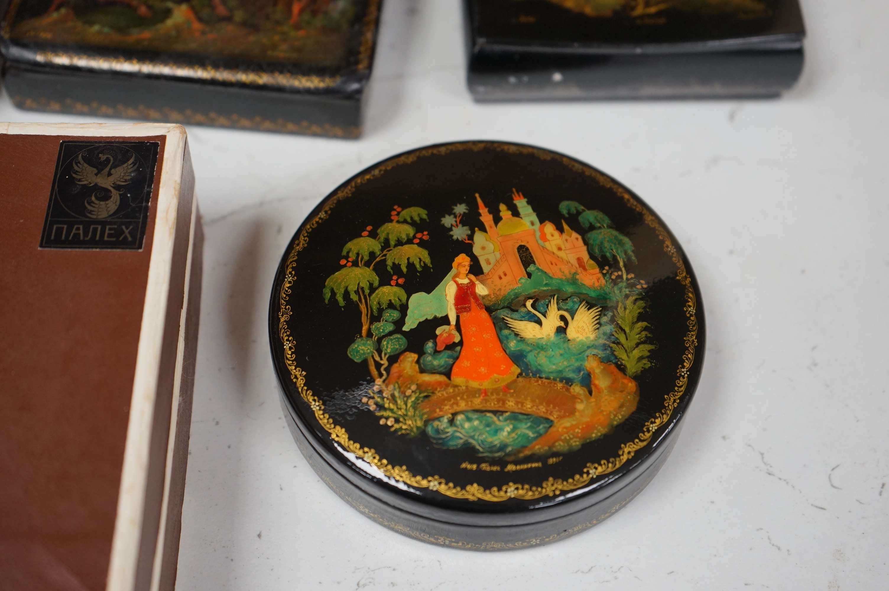 Six late 19th / early 20th century Russian lacquer boxes to include a circular example, largest 15cm wide. Condition - good